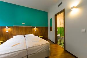 A bed or beds in a room at Safestay Bratislava Presidential Palace