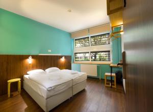 A bed or beds in a room at Safestay Bratislava Presidential Palace