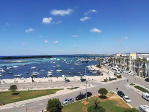 a view of a harbor with boats in the water at Quilungomare in Porto Cesareo +5 photos
