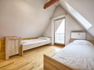 Posteľ alebo postele v izbe v ubytovaní VisitZakopane - Mount Everest Apartment