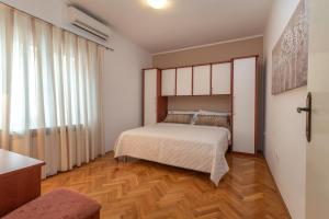 Postel nebo postele na pokoji v ubytování Marinella