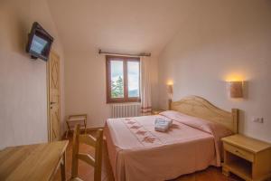 Postel nebo postele na pokoji v ubytování Gorropu Hotel + 37 fotografií