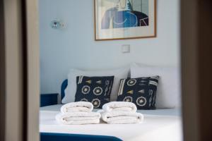 מיטה או מיטות בחדר ב-Bouganvillia Villa Latura