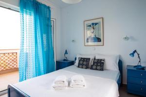 Postel nebo postele na pokoji v ubytování Bouganvillia Villa Latura