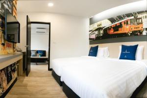 Voodi või voodid majutusasutuse Tarawish Hotel toas