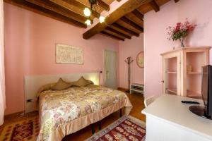 Katil atau katil-katil dalam bilik di La Fossetta B&B