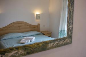 Postel nebo postele na pokoji v ubytování Gorropu Hotel