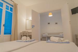 Postel nebo postele na pokoji v ubytování Ostria Hotel & Apartments