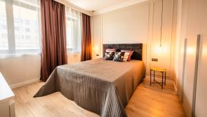 Postel nebo postele na pokoji v ubytování A11 Apartments & SPA Dermique