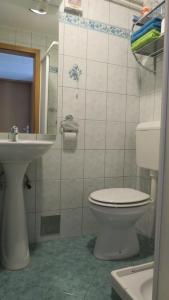 a bathroom with a toilet and a sink at D-D in Bovec +19 photos
