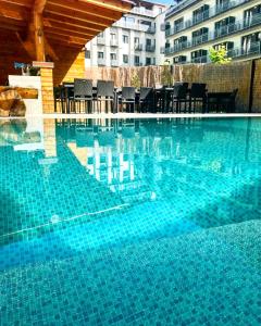Πισίνα στο ή κοντά στο eFi Palace Hotel