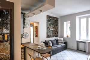 a living room with a couch and a table at Lia Apartment 2 in La Spezia
