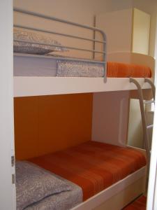 Кровать или кровати в номере Harbor terrace - two bedroom apartment