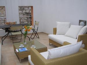 a living room with a couch and a table at Harbor terrace - two bedroom apartment in Murter +13 photos