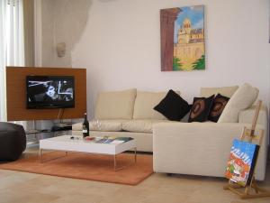 a living room with a couch and a coffee table at Harbor terrace - two bedroom apartment in Murter