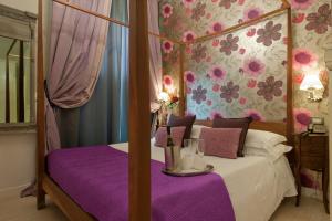 A bed or beds in a room at The B Place