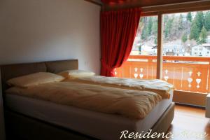 A bed or beds in a room at Residence Rose