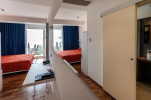 Postel nebo postele na pokoji v ubytování Hotel Internazionale