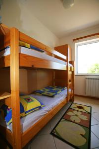 Posteľ alebo postele v izbe v ubytovaní Apartments Villa Oliva + 37 fotografií