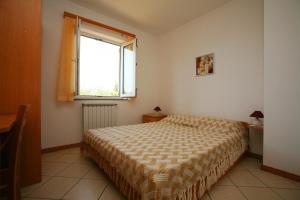 Posteľ alebo postele v izbe v ubytovaní Apartments Villa Oliva