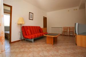 Televízia a/alebo spoločenská miestnosť v ubytovaní Apartments Villa Oliva
