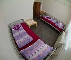 an overhead view of two beds in a room at Hotelak Martinov in Ostrava