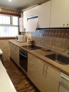 Kuchyň nebo kuchyňský kout v ubytování Acogedor Apartamento 2ª línea playa
