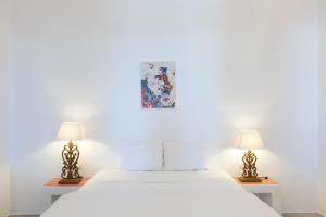 Voodi või voodid majutusasutuse Desiterra Resort & Spa toas