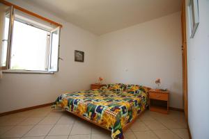Posteľ alebo postele v izbe v ubytovaní Apartments Villa Oliva