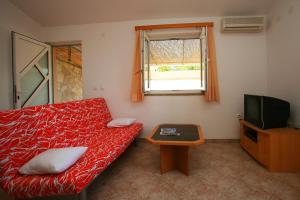 Televízia a/alebo spoločenská miestnosť v ubytovaní Apartments Villa Oliva
