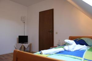 Postel nebo postele na pokoji v ubytování Gasthof Gruner Baum
