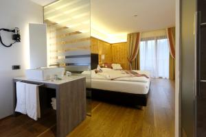 Postel nebo postele na pokoji v ubytování Hotel Shandranj