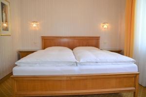Ένα ή περισσότερα κρεβάτια σε δωμάτιο στο Hotel An Der Wien