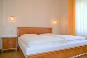 Ένα ή περισσότερα κρεβάτια σε δωμάτιο στο Hotel An Der Wien