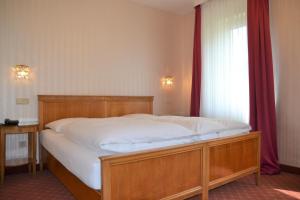 Ένα ή περισσότερα κρεβάτια σε δωμάτιο στο Hotel An Der Wien