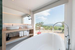 A bed or beds in a room at Cas Cabo Nou Agroturismo Adults Only