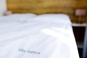 Postel nebo postele na pokoji v ubytování Apartamenty Villa Baltica Rewal - jacuzzi na dachu, wi-fi, parking w cenie
