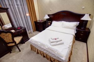 Кровать или кровати в номере Hotel Carol