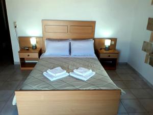 A bed or beds in a room at Traditional House Koukounara