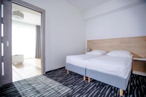 Łóżko lub łóżka w pokoju w obiekcie Villa Baltica Rewal