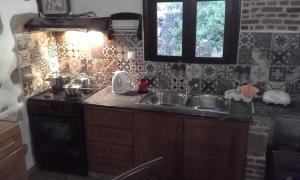 A kitchen or kitchenette at Traditional House Koukounara Még 37 kép
