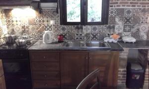 A kitchen or kitchenette at Traditional House Koukounara