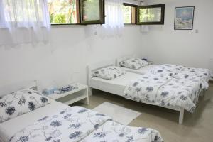 Säng eller sängar i ett rum på Apartman Maksimir Relax Zagreb-75m2