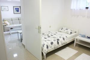 Posteľ alebo postele v izbe v ubytovaní Apartman Maksimir Relax Zagreb-75m2