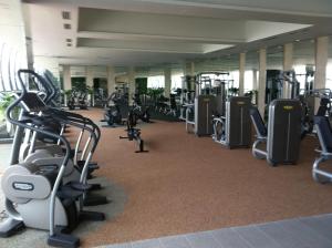 a gym with a lot of treadmills and machines at M City Center Jalan Ampang Lakeview KLCC KL Tower Merdeka 118 TRX View in Kuala Lumpur