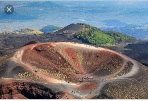 an aerial view of a dirt road on a mountain at Luxurious Street Apartments in Catania