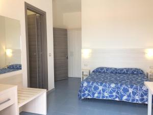 Postel nebo postele na pokoji v ubytování Hotel La Playa