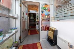 an entrance to a store with a door open at Hotel Villa Harmony in Sarajevo