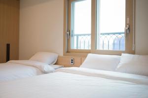 Postel nebo postele na pokoji v ubytování Hotel Run