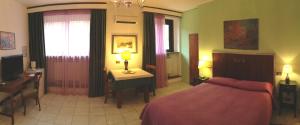 Posteľ alebo postele v izbe v ubytovaní B&B Villa Sensi